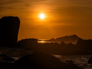 Preview wallpaper rocks, stones, sea, sun, dark