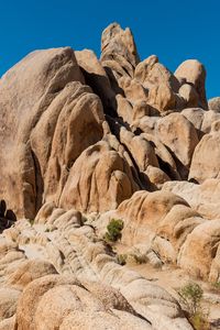 Preview wallpaper rocks, stones, stone, relief, bushes