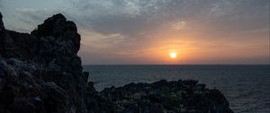 Preview wallpaper rocks, stones, sunset, sun, ocean