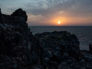 Preview wallpaper rocks, stones, sunset, sun, ocean