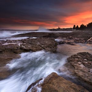 Preview wallpaper rocks, stones, surf, sea, sunset