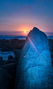 Preview wallpaper rocks, sunset, rays, sea, twilight
