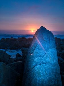 Preview wallpaper rocks, sunset, rays, sea, twilight