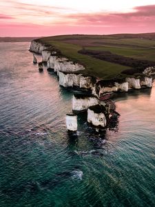 Preview wallpaper rocks, sunset, sea, coast, island