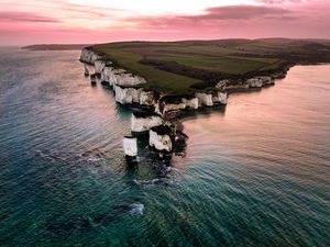 Preview wallpaper rocks, sunset, sea, coast, island