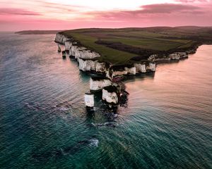 Preview wallpaper rocks, sunset, sea, coast, island