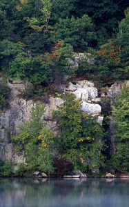 Preview wallpaper rocks, trees, lake, vegetation, water smooth surface