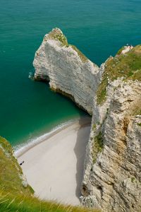 Preview wallpaper rocks, water, beach, grass, nature