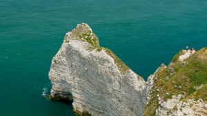 Preview wallpaper rocks, water, beach, grass, nature
