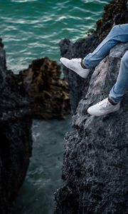 Preview wallpaper rocks, water, legs, sneakers, shore