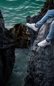 Preview wallpaper rocks, water, legs, sneakers, shore