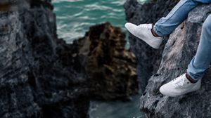 Preview wallpaper rocks, water, legs, sneakers, shore