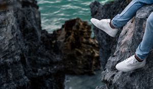 Preview wallpaper rocks, water, legs, sneakers, shore