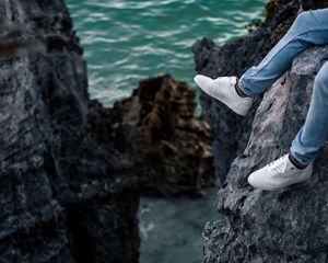 Preview wallpaper rocks, water, legs, sneakers, shore