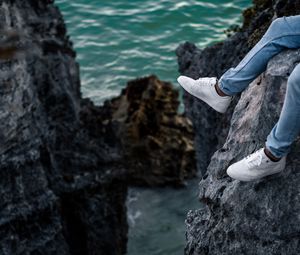 Preview wallpaper rocks, water, legs, sneakers, shore