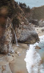 Preview wallpaper rocks, waterfall, sea, coast, beach