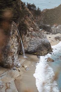 Preview wallpaper rocks, waterfall, sea, coast, beach
