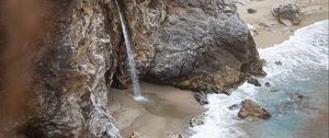 Preview wallpaper rocks, waterfall, sea, coast, beach