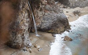 Preview wallpaper rocks, waterfall, sea, coast, beach