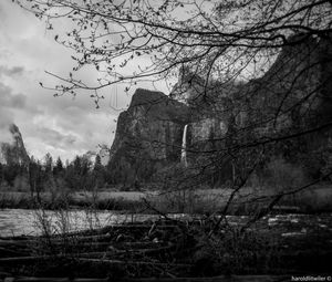 Preview wallpaper rocks, waterfall, trees, branches, pond, black and white