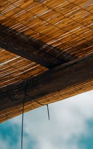 Preview wallpaper roof, bamboo, rope, sky