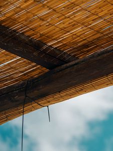 Preview wallpaper roof, bamboo, rope, sky