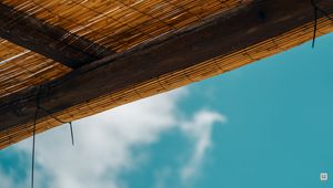 Preview wallpaper roof, bamboo, rope, sky