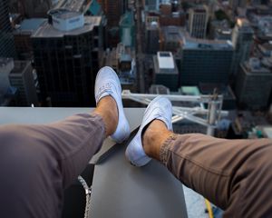 Preview wallpaper roof, city, aerial view, legs, overview