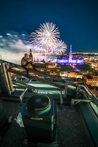 Preview wallpaper roof, night city, aerial view, silhouette, fireworks, overview