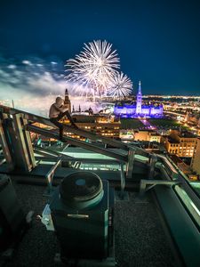 Preview wallpaper roof, night city, aerial view, silhouette, fireworks, overview