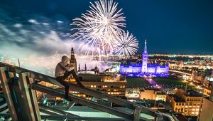 Preview wallpaper roof, night city, aerial view, silhouette, fireworks, overview