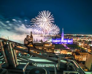 Preview wallpaper roof, night city, aerial view, silhouette, fireworks, overview