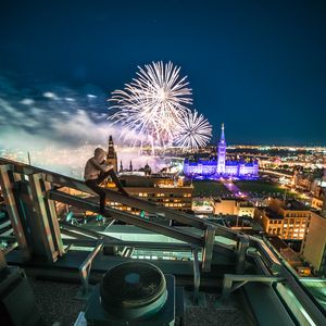 Preview wallpaper roof, night city, aerial view, silhouette, fireworks, overview