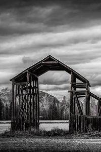 Preview wallpaper roof, wooden, building, sky, bw