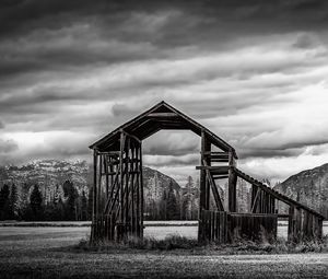 Preview wallpaper roof, wooden, building, sky, bw