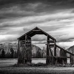 Preview wallpaper roof, wooden, building, sky, bw