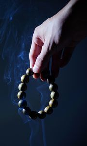 Preview wallpaper rosary, hand, smoke