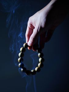 Preview wallpaper rosary, hand, smoke