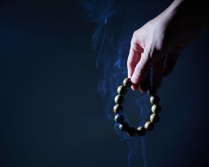 Preview wallpaper rosary, hand, smoke