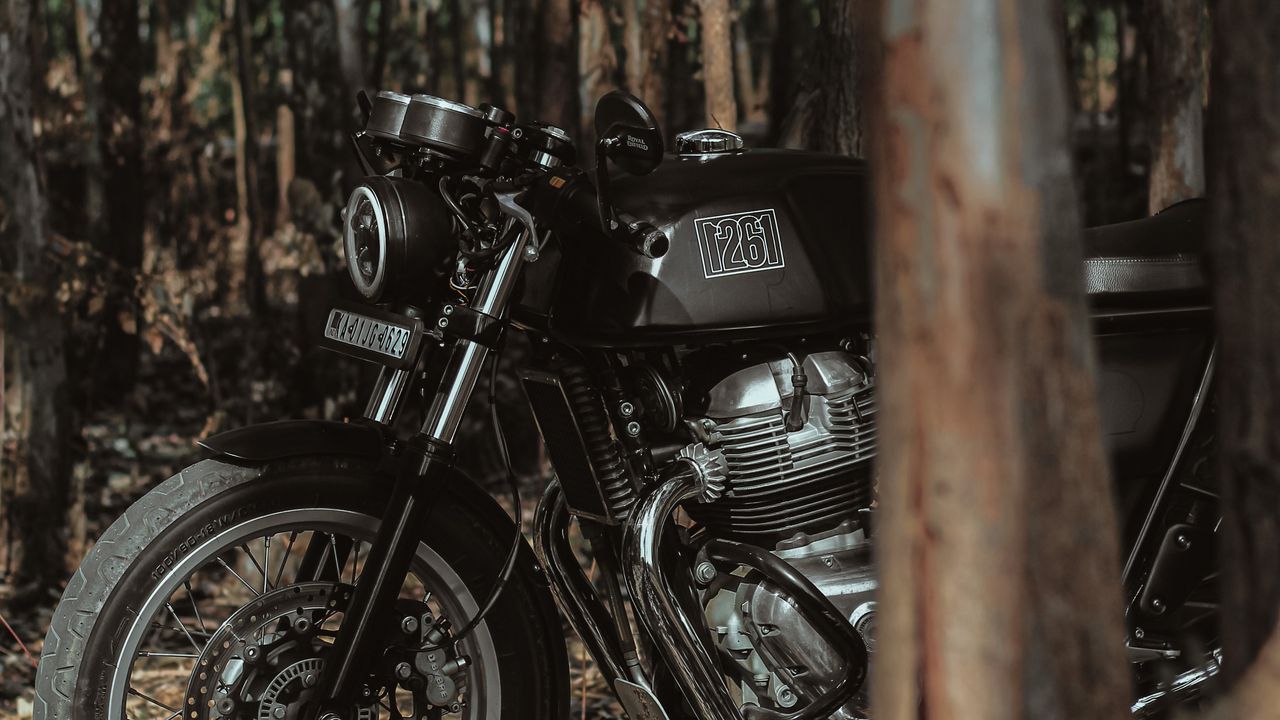 1280x720 Wallpaper royal enfield, motorcycle, bike, black, forest