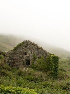 Preview wallpaper ruins, mountains, grass, fog