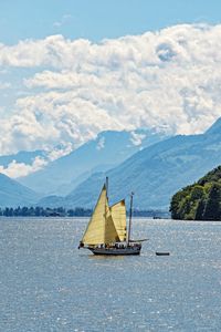 Preview wallpaper sailboat, boat, sea, hills, sky