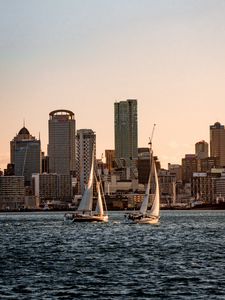 Preview wallpaper sailboat, city, buildings, skyscrapers, water