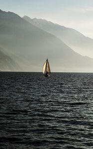 Preview wallpaper sailboat, sea, mountains, fog, waves