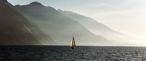 Preview wallpaper sailboat, sea, mountains, fog, waves