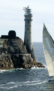 Preview wallpaper sailing vessel, rock, beacon, sea, excursion, tourists