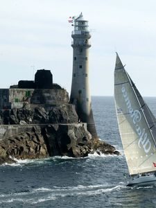 Preview wallpaper sailing vessel, rock, beacon, sea, excursion, tourists