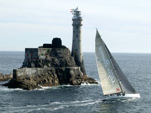 Preview wallpaper sailing vessel, rock, beacon, sea, excursion, tourists