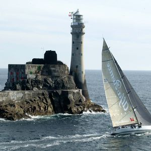 Preview wallpaper sailing vessel, rock, beacon, sea, excursion, tourists