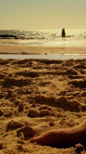 Preview wallpaper sand, coast, beach, feet, tattoo, pair, rest